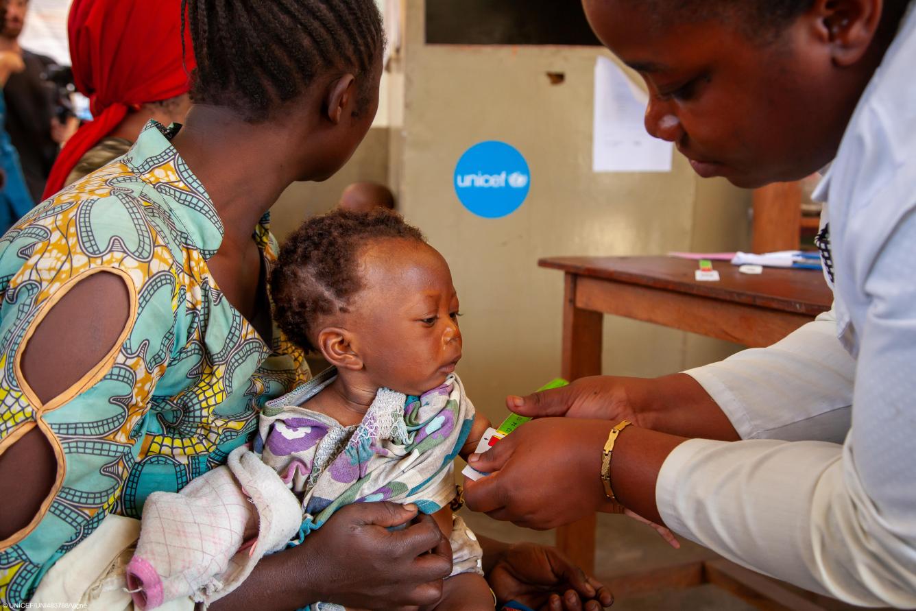 A baby is screened for malnutrition by a nurse at a UNICEF-supported health centre in South Kivu Province, Democratic Republic of the Congo.