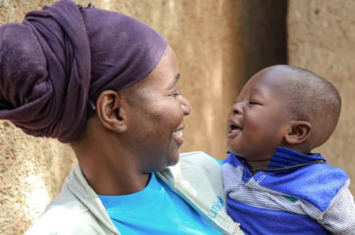 Woman holding a child.