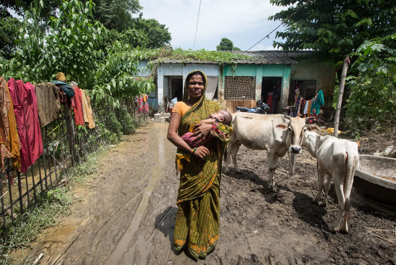 Asha Devi Raya holds her 28-day-old baby daughter
