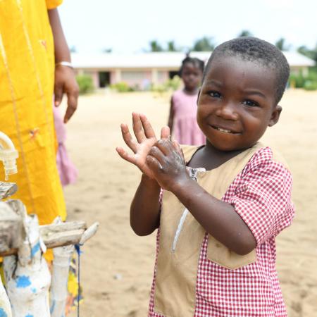 Children wash their hands at school.