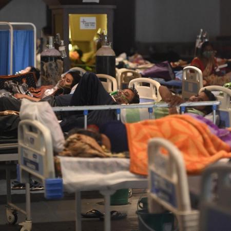 COVID-19 patients are treated in a makeshift ward in India.