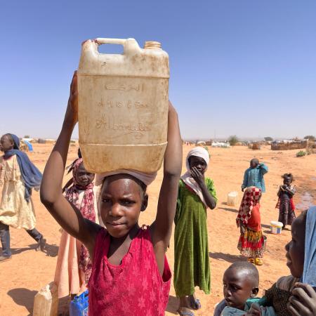 On 3 February 2024, children collect water at a UNICEF borehole inside Adré refugee settlement in Chad.