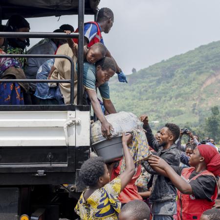 Congolese refugees fleeing ongoing clashes in eastern Democratic Republic of Congo carry their belongings as they arrive at the Rugerero transit camp in Gisenyi on January 28, 2025.